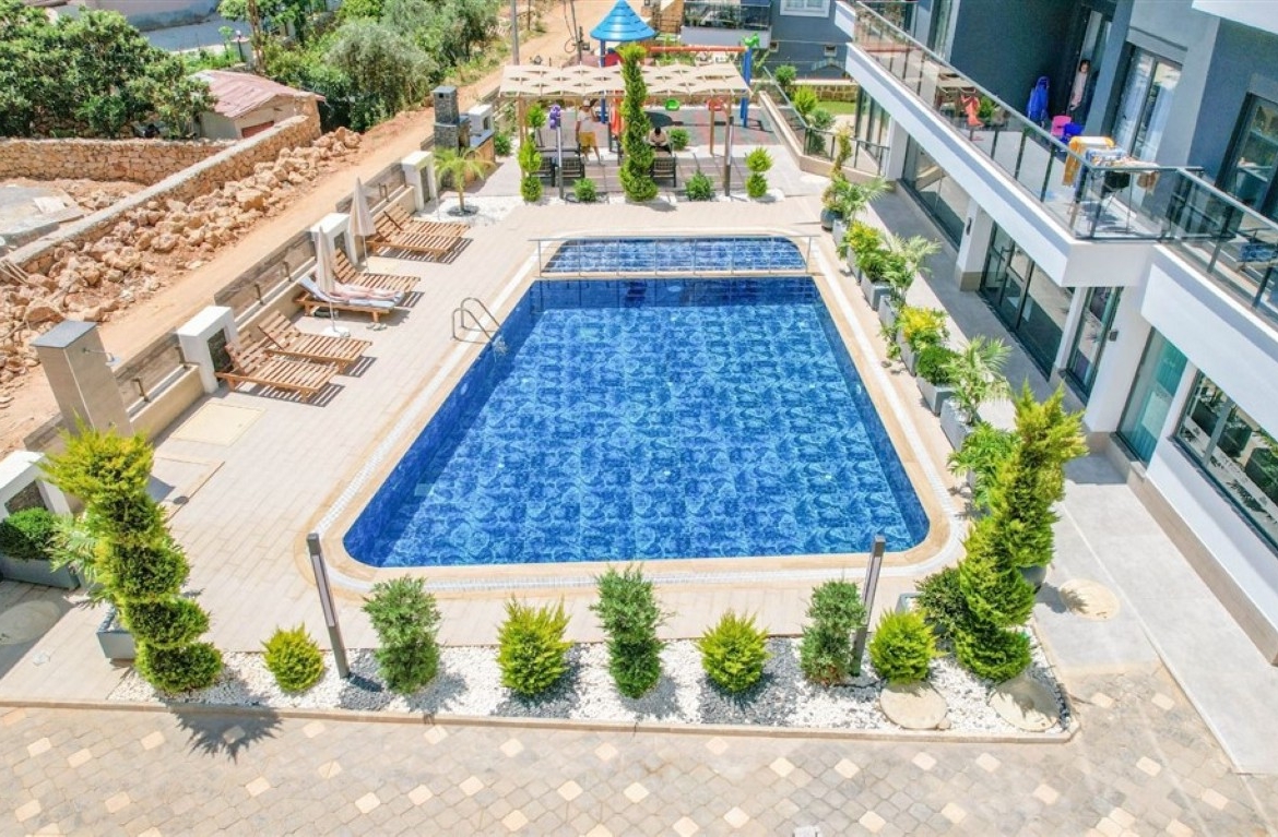 Large outdoor swimming pool for residents in United Suites