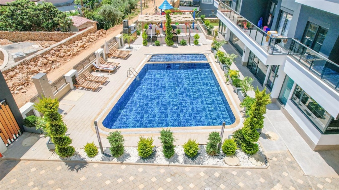 Large outdoor swimming pool for residents in United Suites