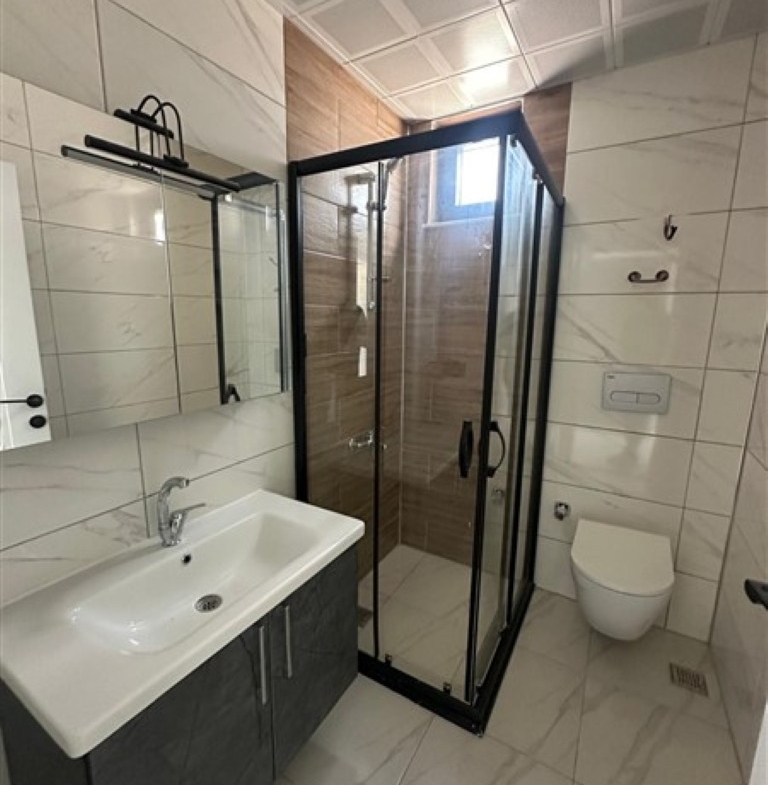 Stylish and clean bathroom design in the United Suites project.