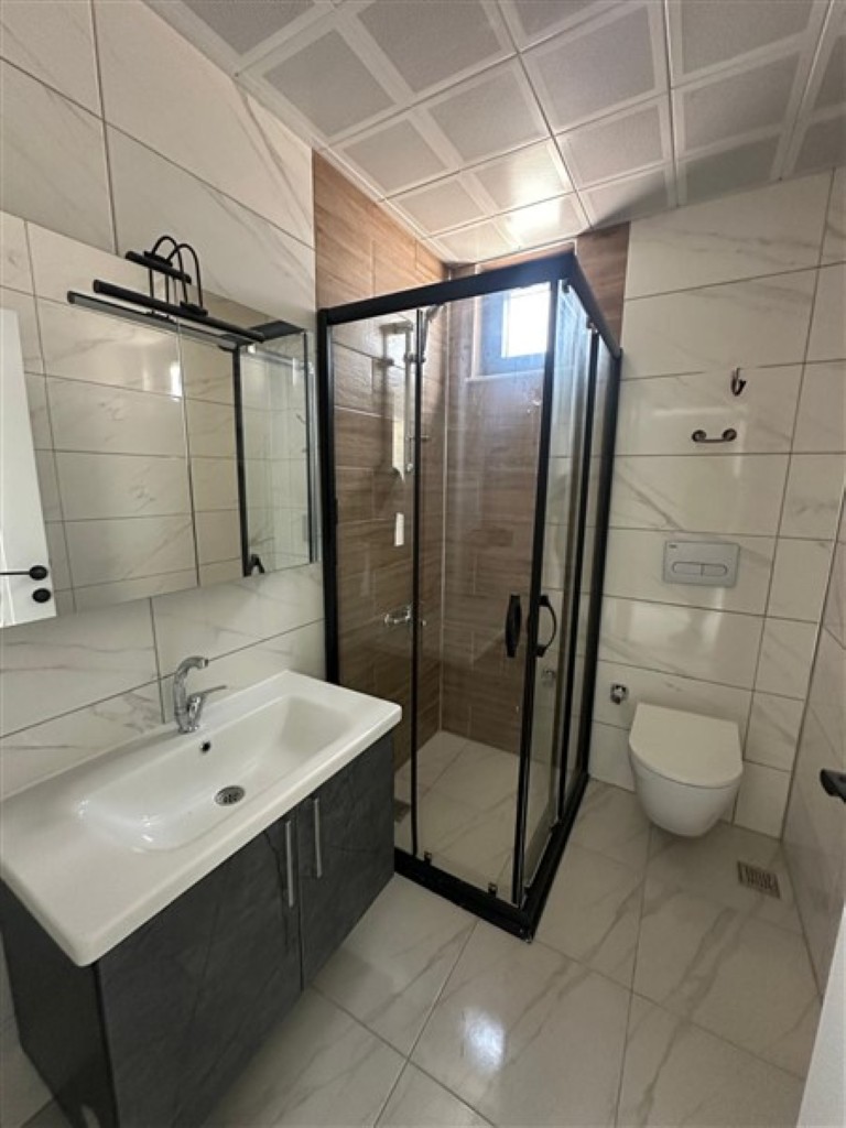 Stylish and clean bathroom design in the United Suites project.