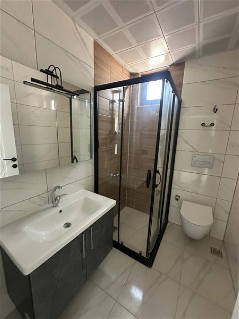 Modern bathroom featuring high-quality ceramic tiles and fixtures.
