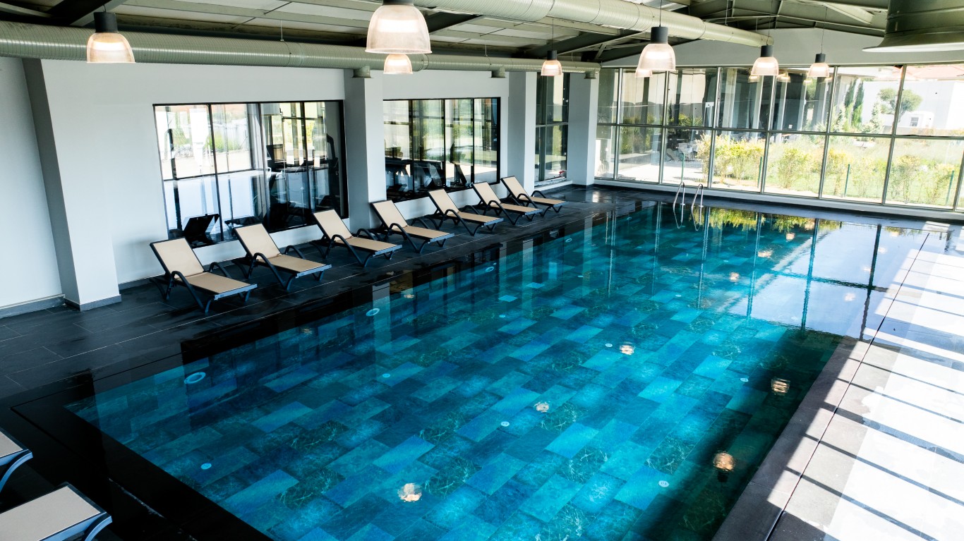 jpg displays the project's exclusive social facility, featuring a large heated indoor swimming pool with modern architectural details.