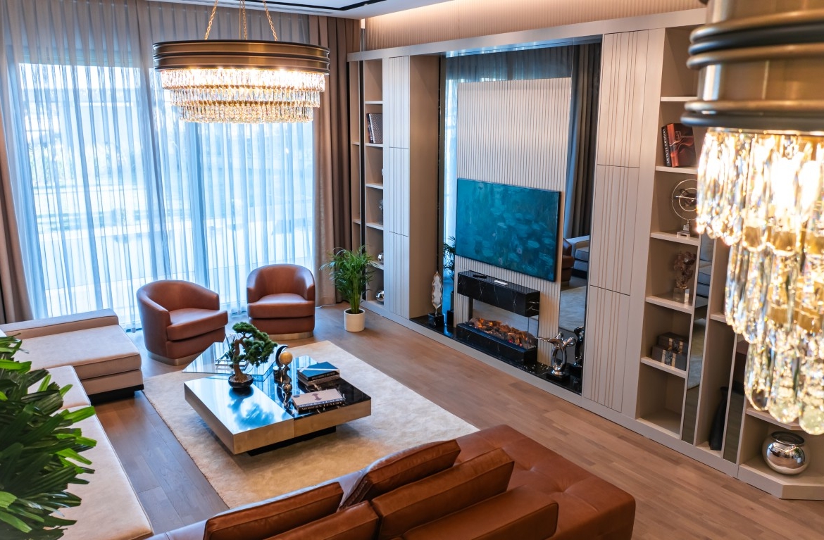 jpg, highlighting comfortable leather seating, a modern TV unit with a built-in fireplace, and chic decor.