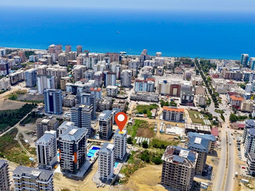 Aerial drone view of the Mahmutlar neighborhood and the Mediterranean Sea showing the location of Best Life 10 apartment building in Alanya