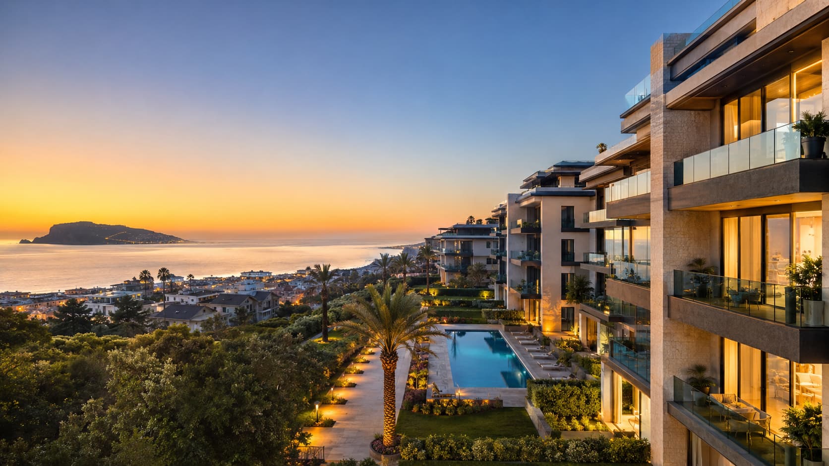 Luxury residential complex with modern architecture illuminated by sunset light on the Mediterranean coast with palm trees.