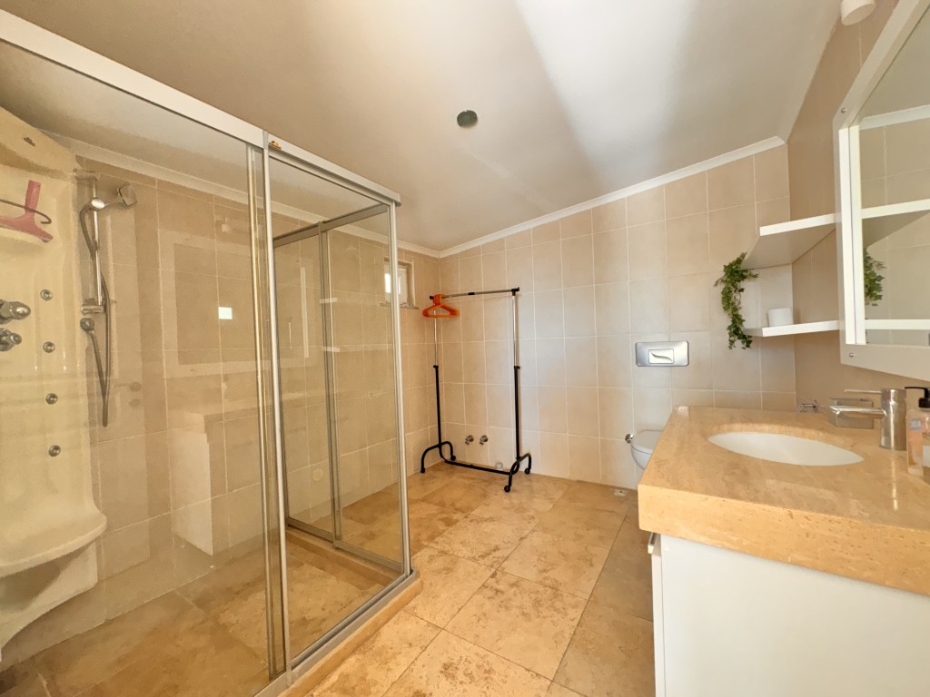 Bathroom with glass shower cabin in Hellios Residence, Cikcilli, Alanya
