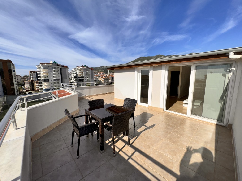 Roof terrace with city and mountain views in Hellios Residence, Cikcilli, Alanya