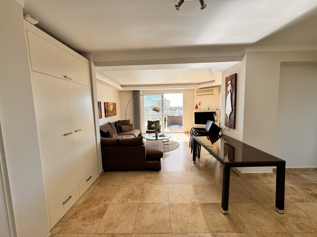 Open-plan living and dining area in Hellios Residence, Cikcilli, Alanya