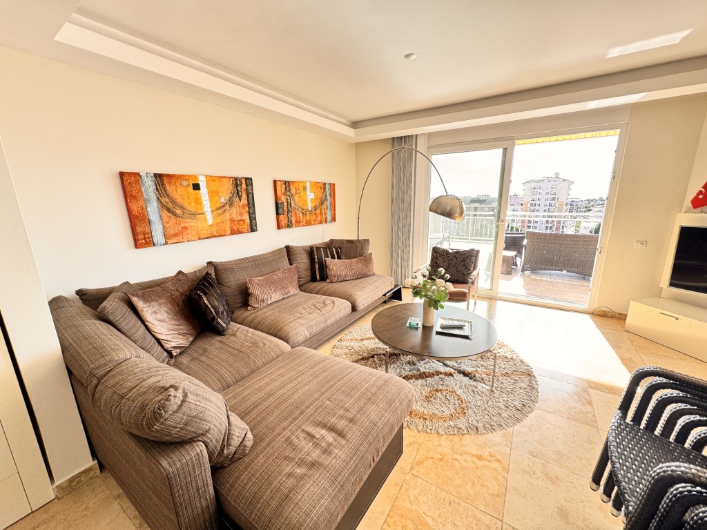 Furnished living room with terrace access in Hellios Residence, Cikcilli, Alanya