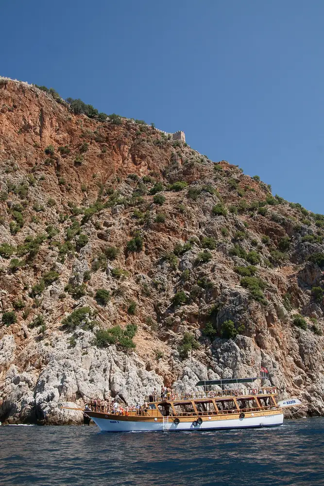 A boat beside Alanya’s peninsula · 2010 archive photograph