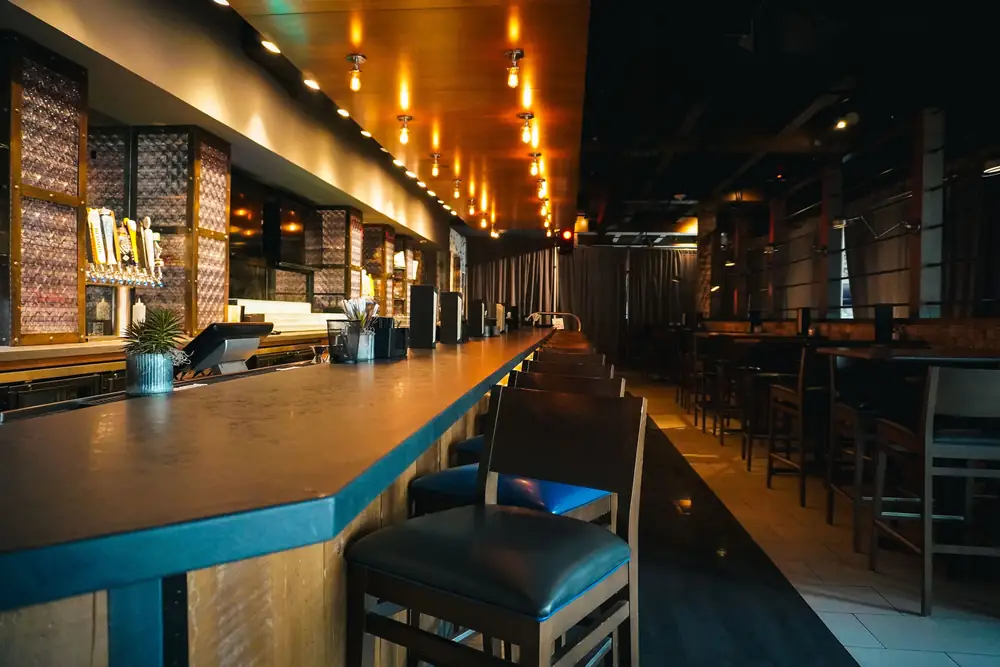 Warm lighting and an inviting bar · illustrative stock photograph