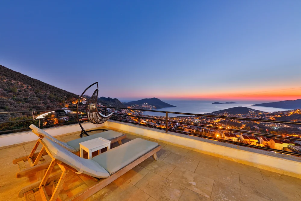 A terrace at sunset · illustrative Mediterranean lifestyle photograph