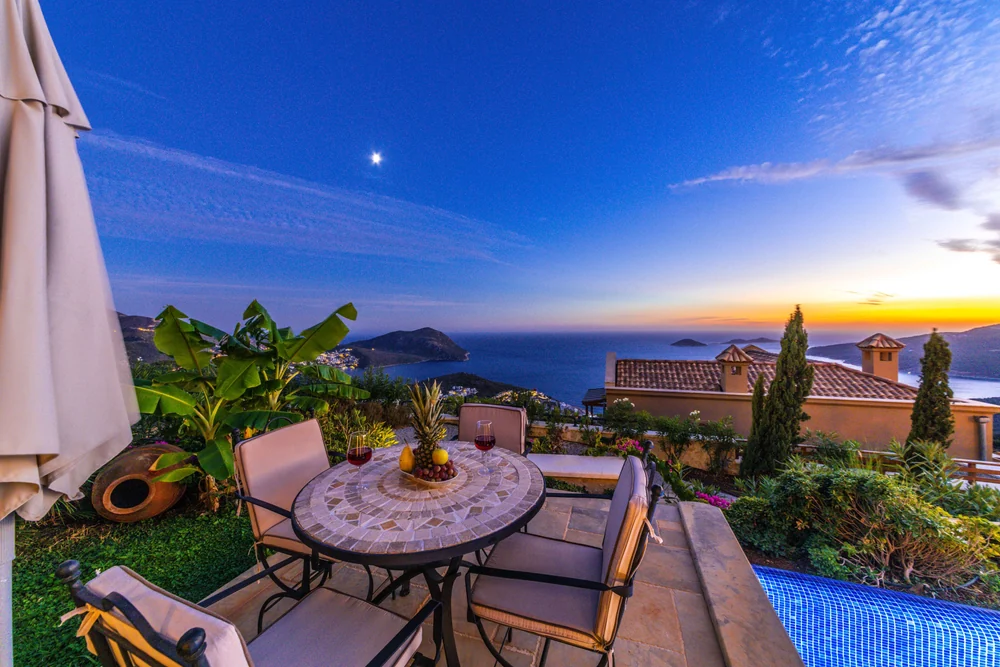 Dinner on a Mediterranean terrace · illustrative lifestyle photograph